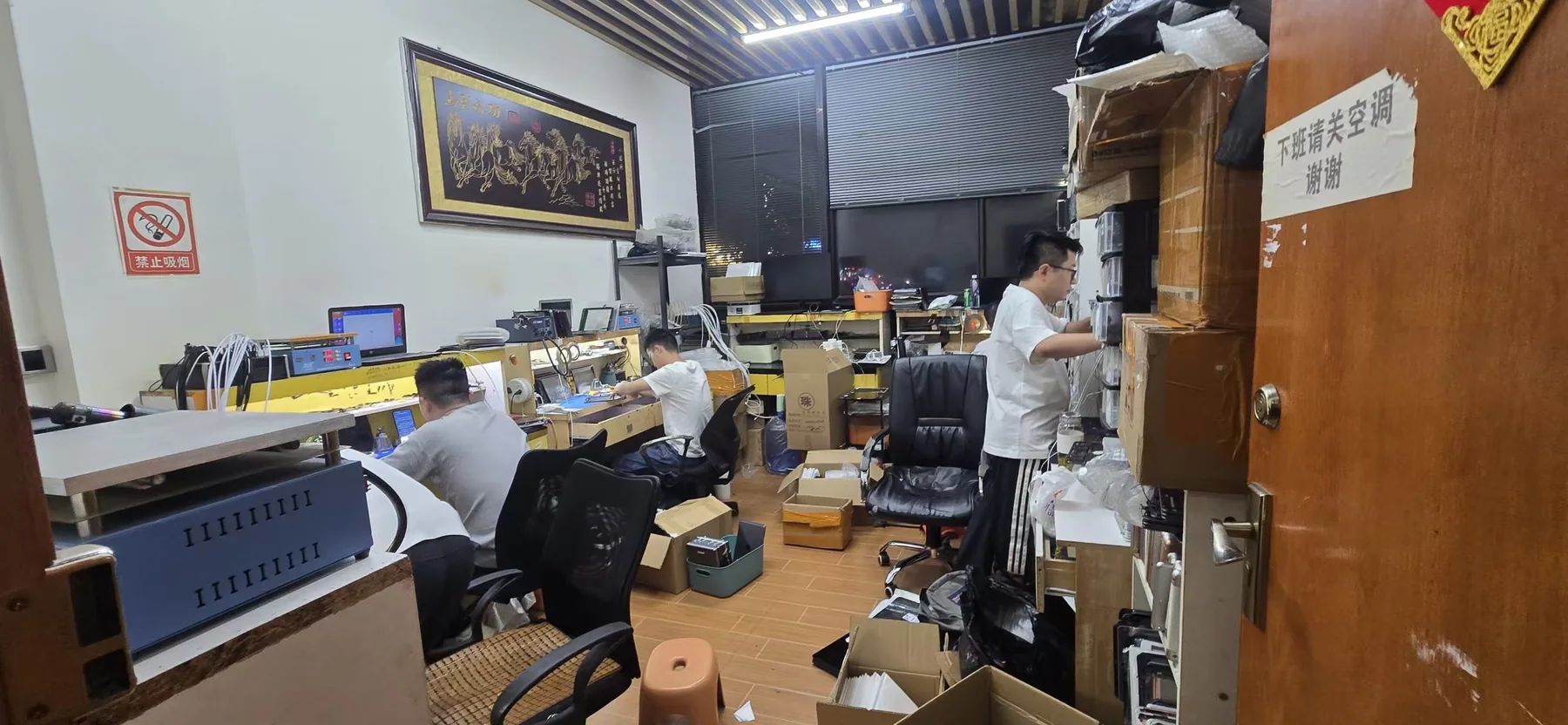 Technicians working on mobile phone refurbishment and inspection